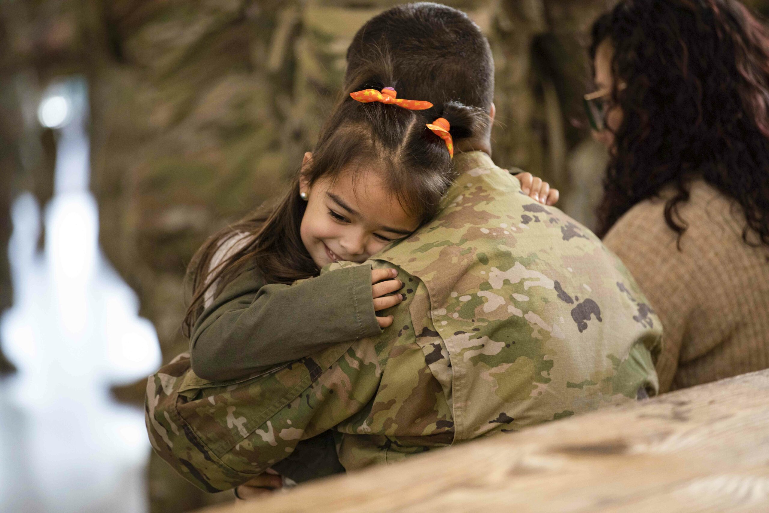 A soldier hugs his daughter at Fort Bragg, N.C., Dec. 12, 2022, after a nine-month deployment to Europe in support of Atlantic Resolve. Photo By: Army Sgt. Daniel Ramos From defense.gov